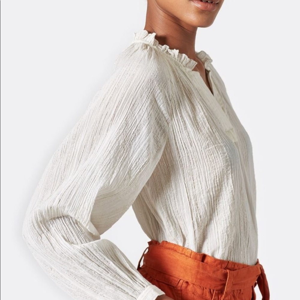 White shimmering top